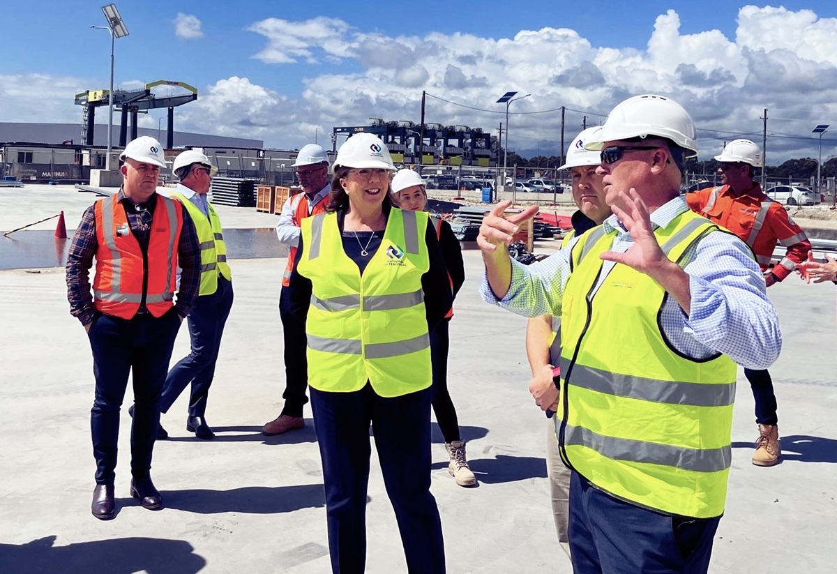 Catherine King MP with people in hi-vis vests on a construction site