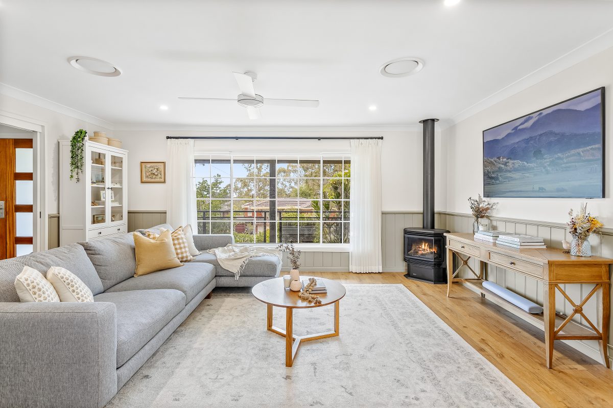 Lounge room with fireplace at 14 Belwarra Avenue in Figtree