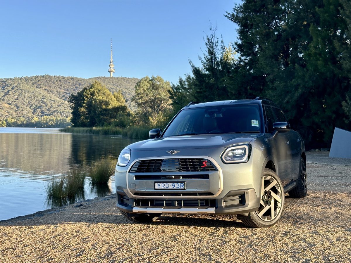 front of car by a lake