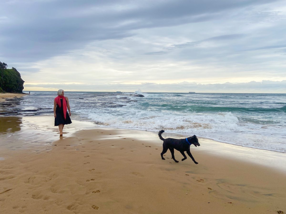 woman and dog at beach