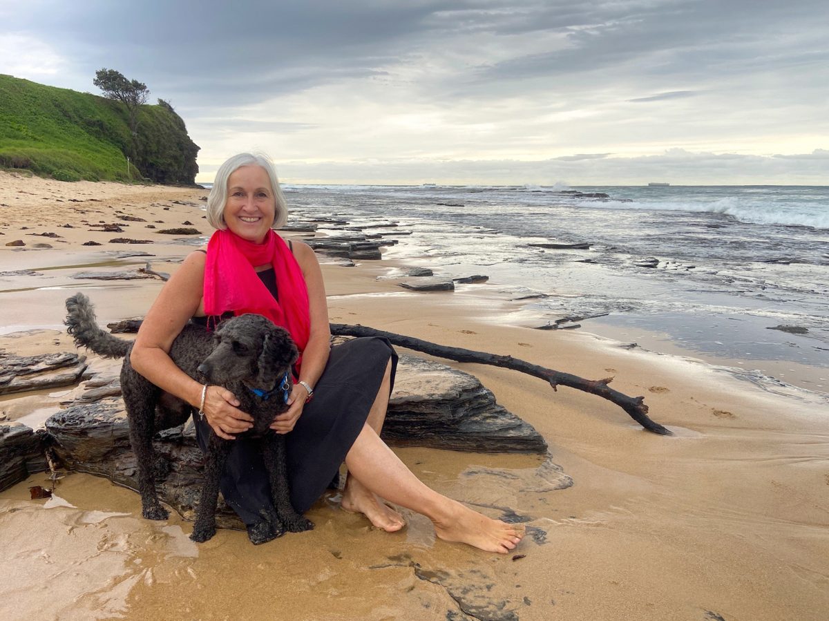 woman and dog at beach
