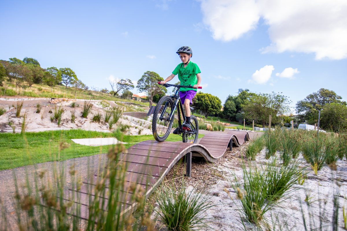 Child rides bike at Cringila Hills Recreation Park