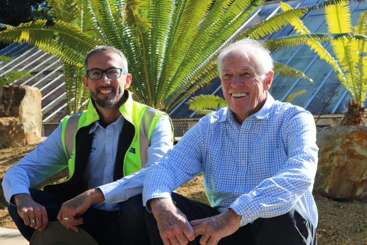 Two men in front of garden at Wollongong Botanic Garden