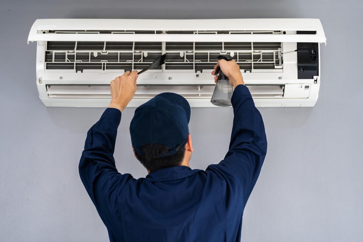 man working on air conditioner