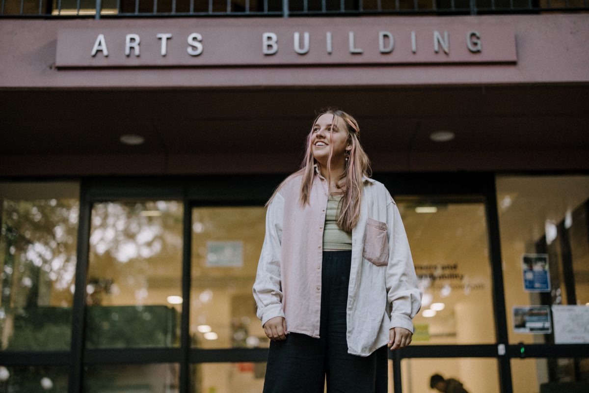 UOW student Carly Lavings in front of the Arts Building