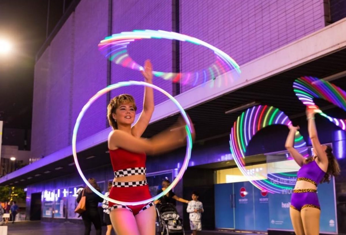 Bianca and Lauren dancing with rainbow hula hoops