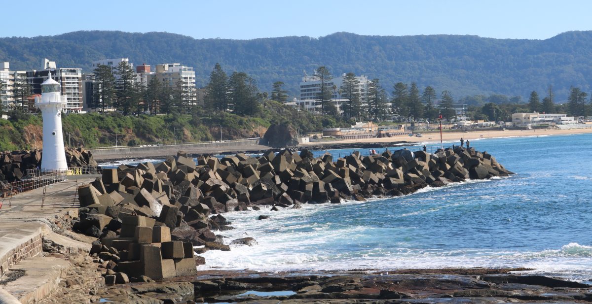 Wollongong's breakwall around the harbour and the escarpment in the distance.