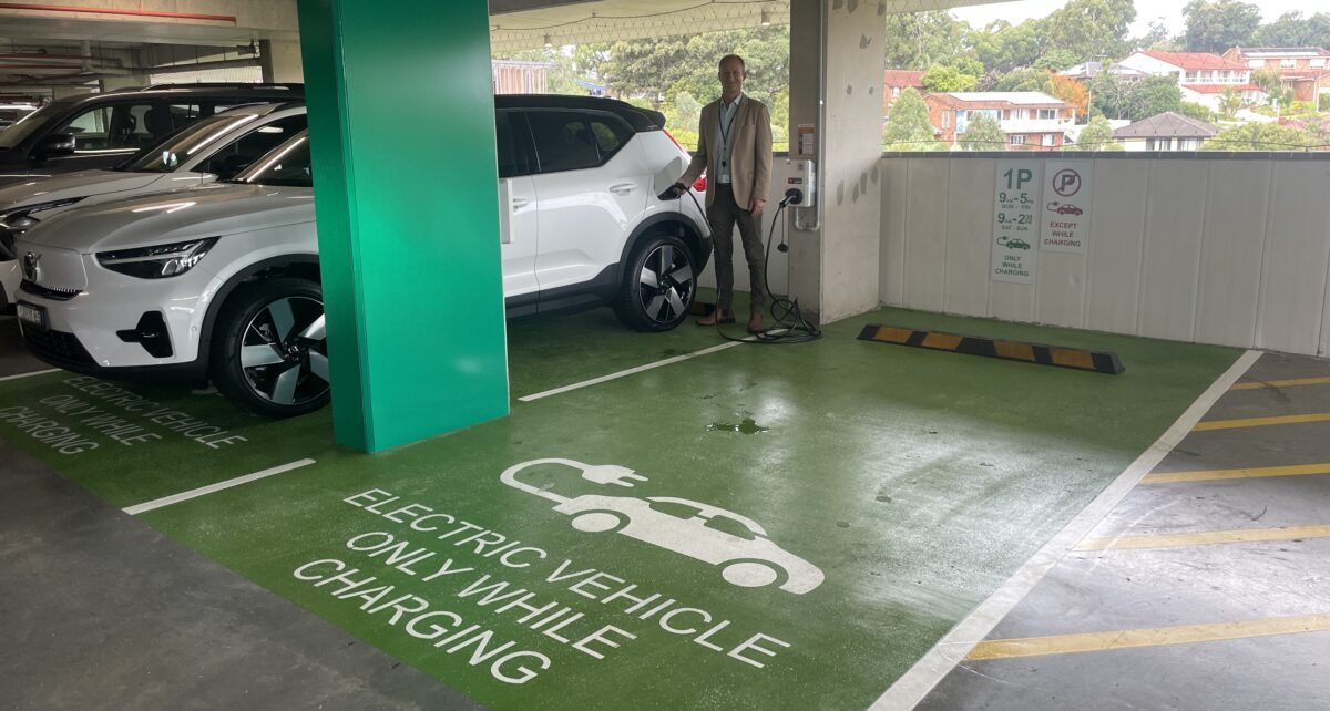 Shellharbour Mayor Chris Homer uses new EV charging ports at the Civic Centre