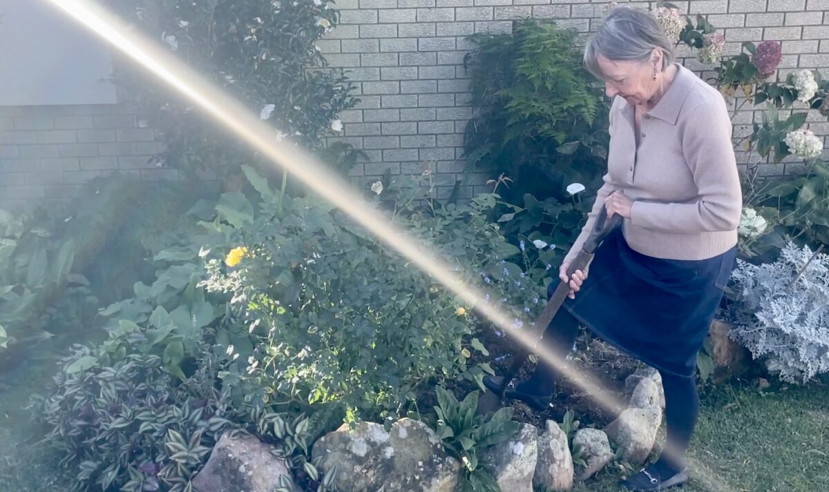 Judith Oyston working in her garden