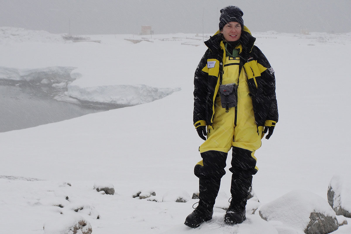 woman standing on arctic snow