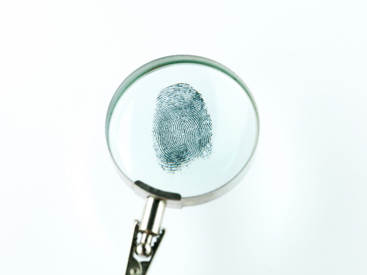 Magnifying glass with a fingerprint on it
