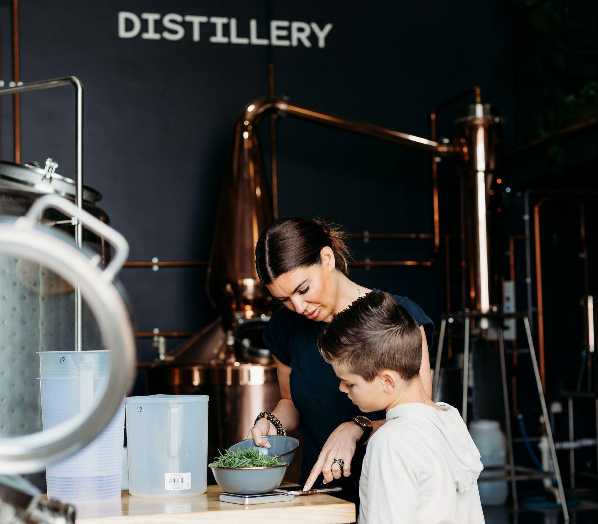 April Grenfeld and her son at the Wolf Woman Distillery