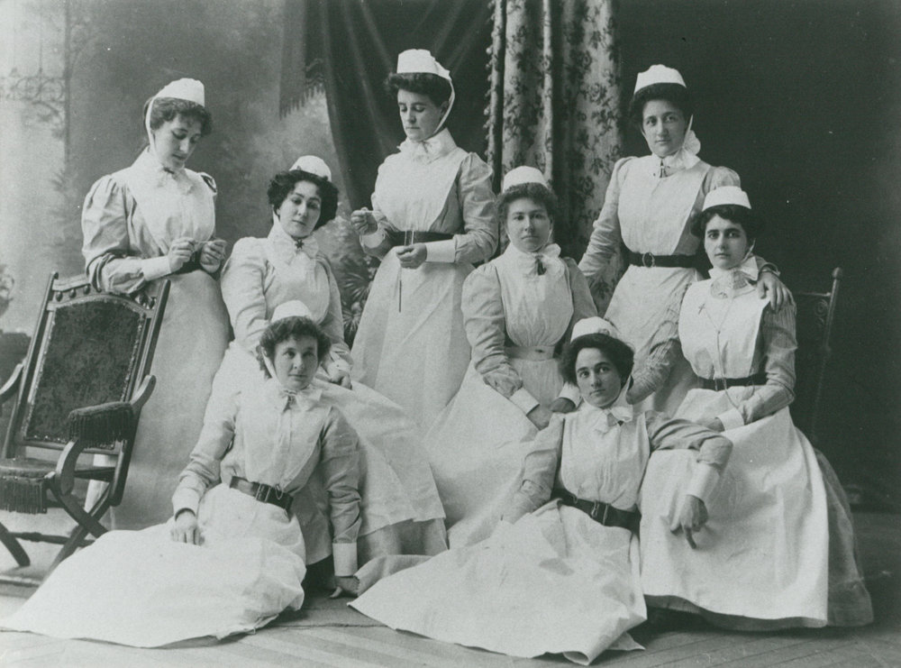 Photo of a group of nurses at their graduation, including Henrietta Lewis.