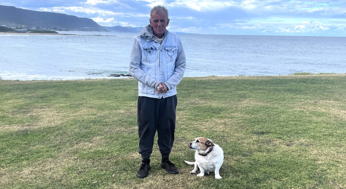 Bill Lenane with his dog at Bulli Beach.