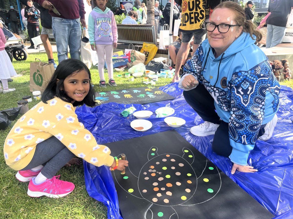 Shellharbour Civic Centre child painting for NAIDOC week.