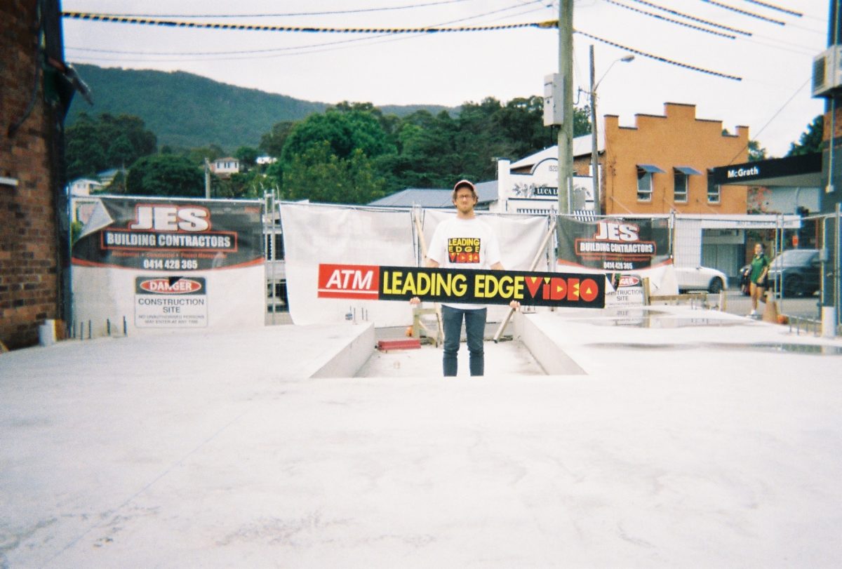 Steve Wilson-Alexander holds Leading Edge Video sign