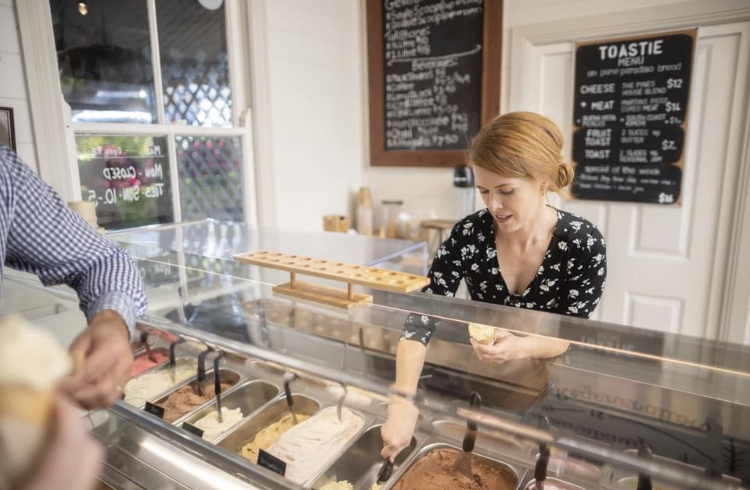 Mahlah Grey, the co-owner of The Pines Kiama serves gelato at The Pines Pantry, on Collins Street, Kiama.