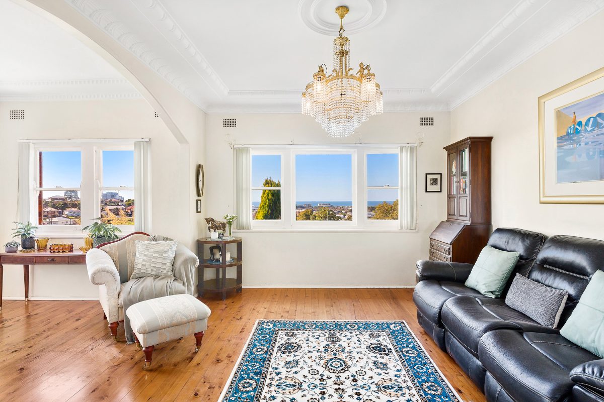 Lounge room with glimpses to the ocean at 50 McKenzie Avenue in Wollongong