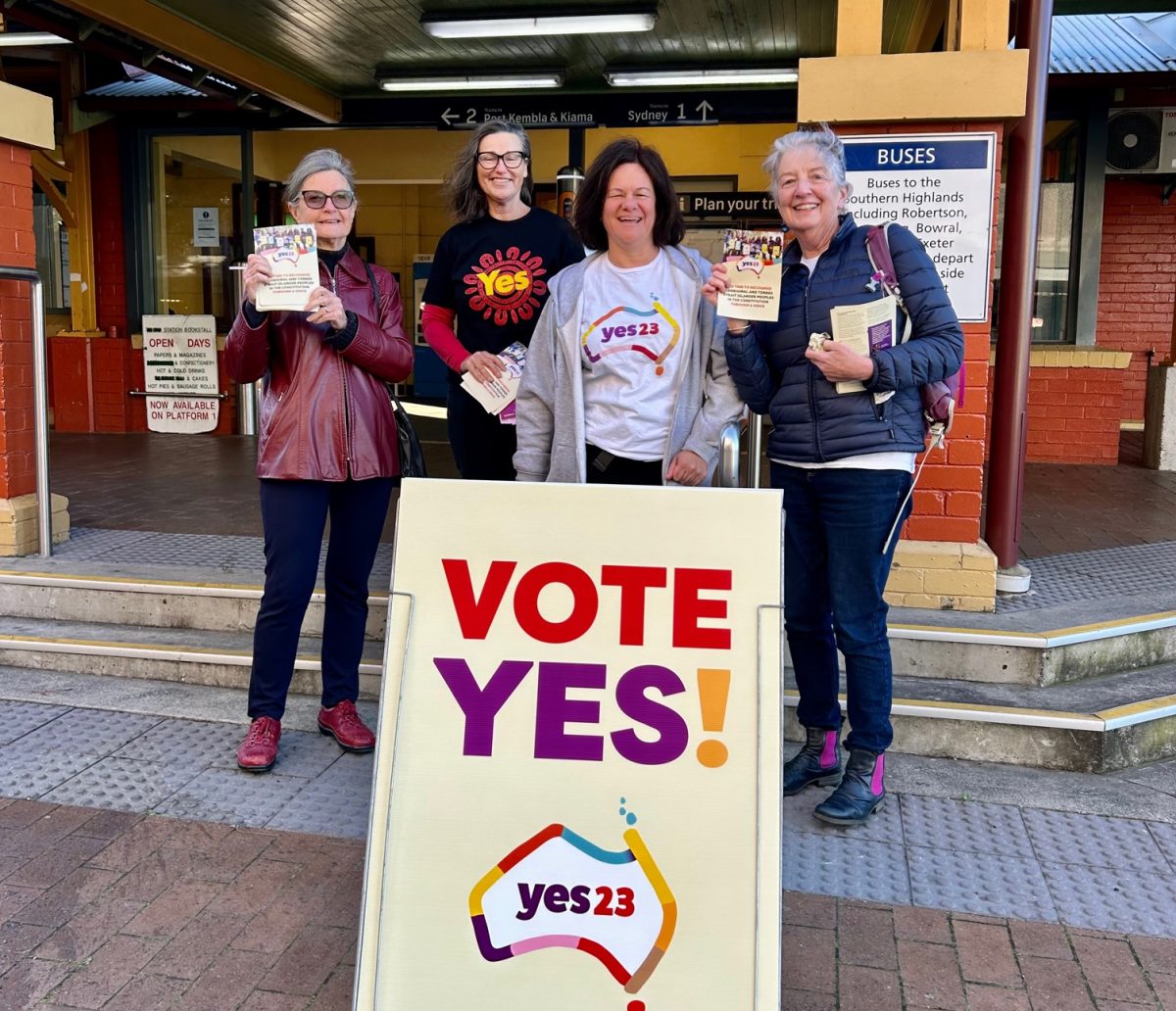 Four volunteers with a vote yes sign and pamphlets at Wollongong train station.