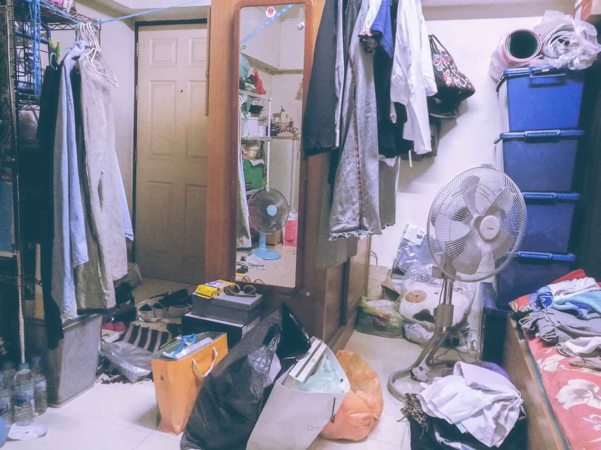a cluttered wardrobe and room.