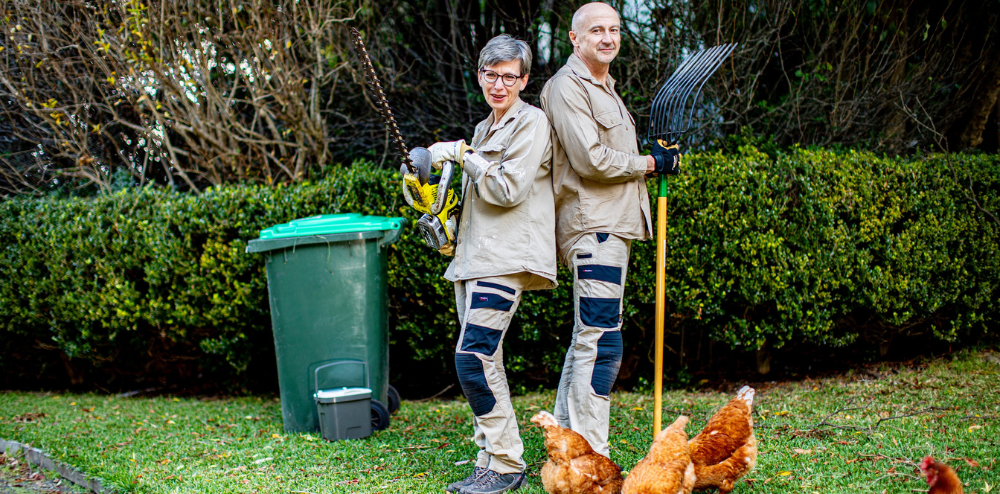 Mel and Dave in the garden with their green waste bin.
