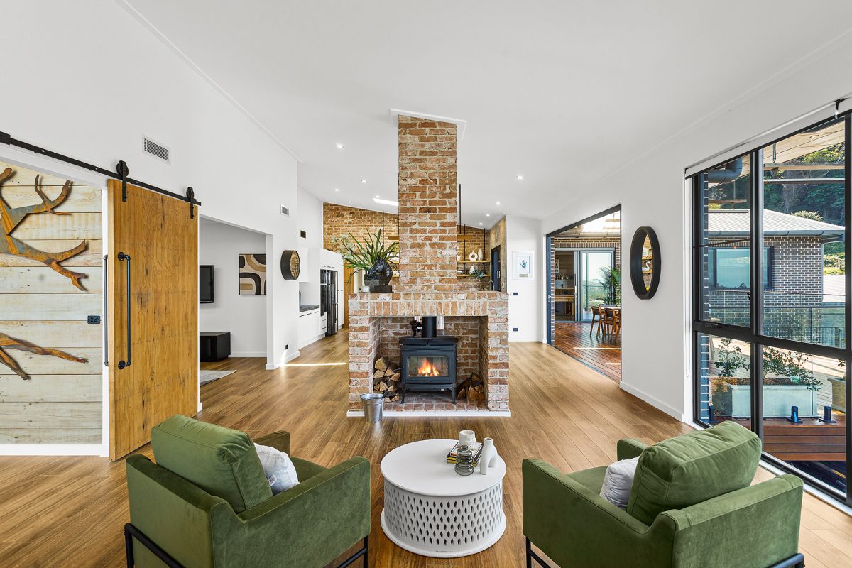 Loungeroom with fireplace at 25 Canaan Ave in Figtree