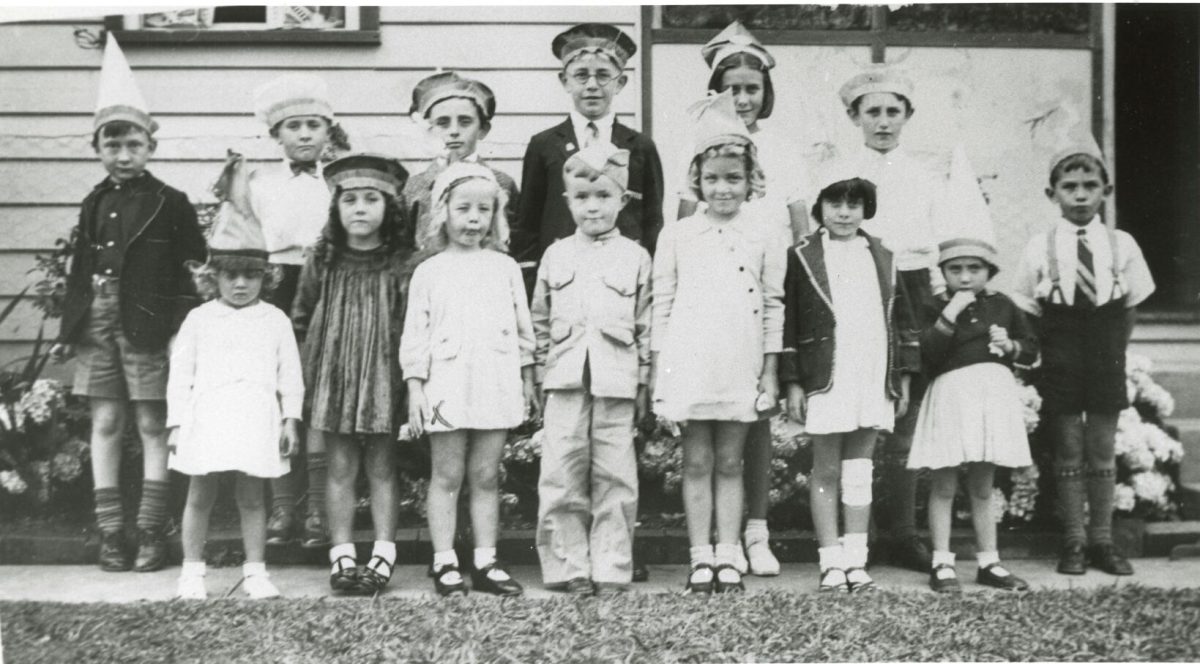 Two rows of children at a birthday party at the Massey home in Kanahooka.