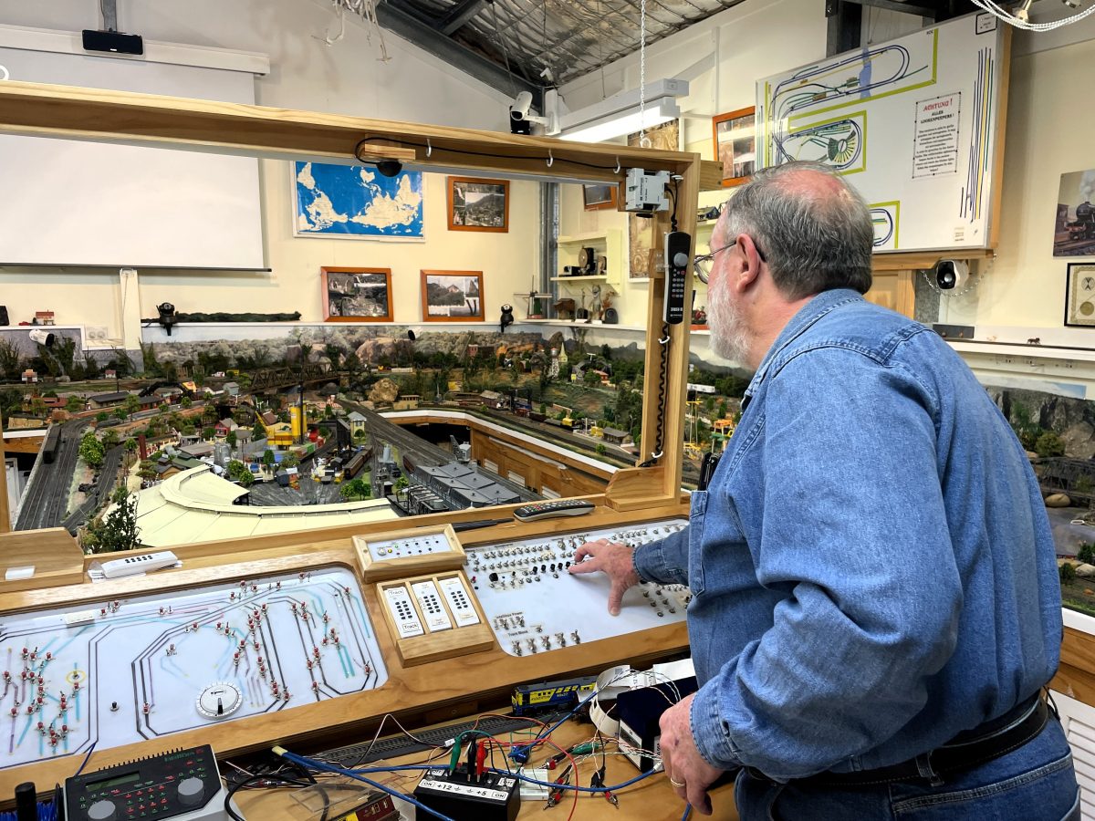 Dennis Frost controlling his model railway.