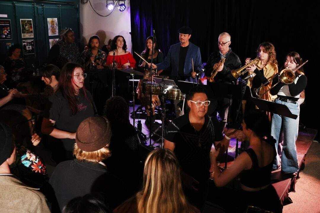 A photograph of a crowd during a performance