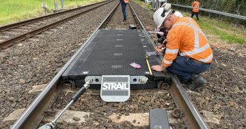 Bellambi rolls out the rubber panels to make rail level crossing safer for pedestrians