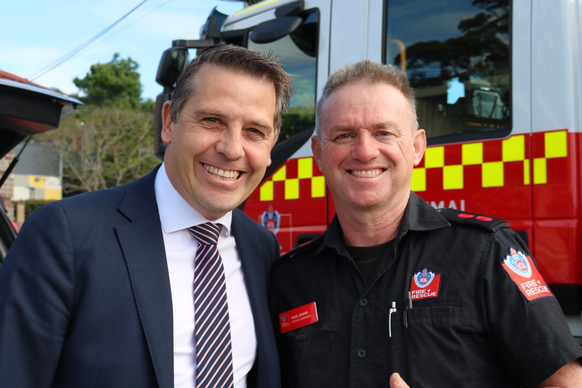 Ryan Park and Paul Dorin in front of a fire engine at Corrimal station.