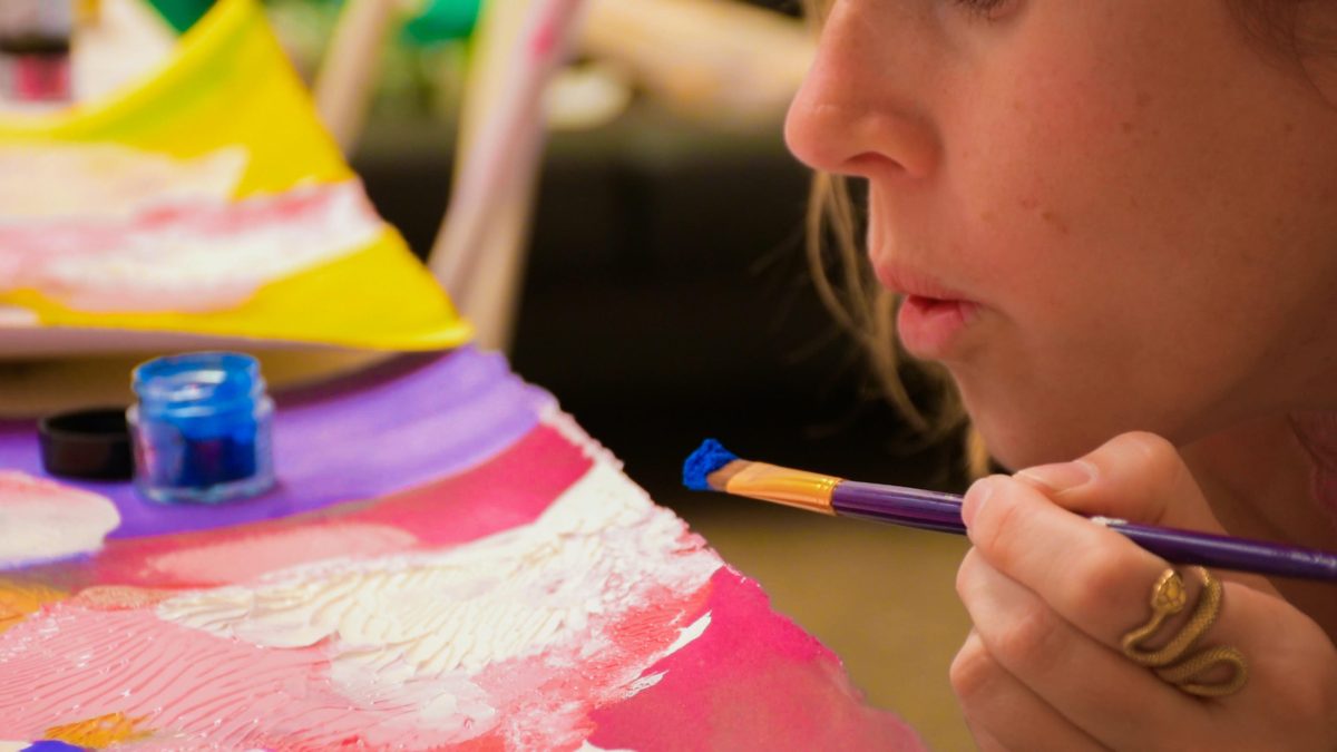 Artist Tegan Georgette creating art in her studio