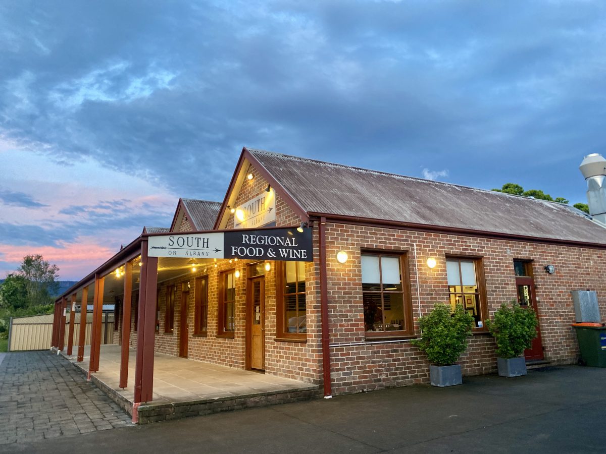 Exterior shot of South on Albany restaurant at sunset