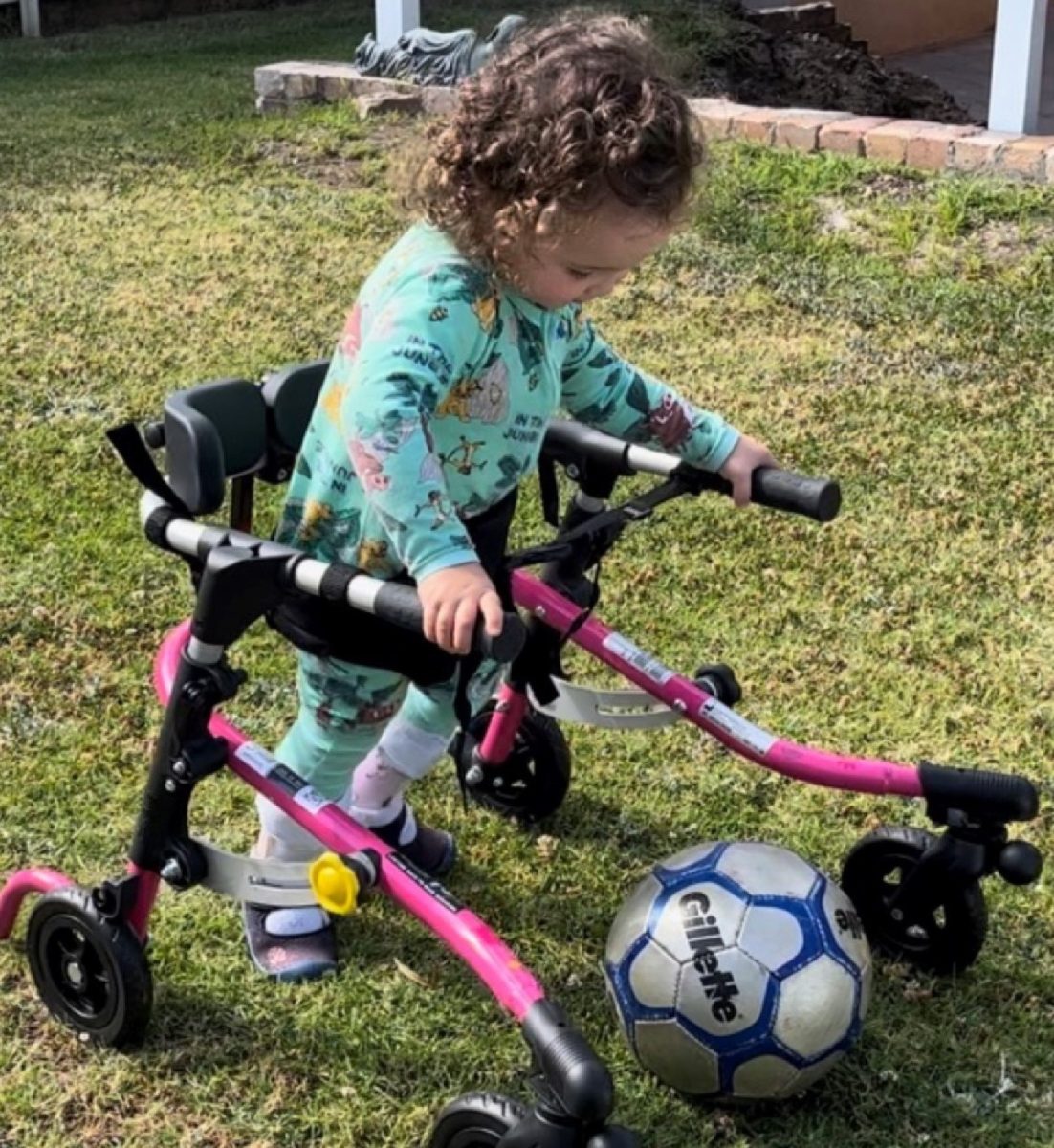 Ellie King in frame kicking with soccer ball.