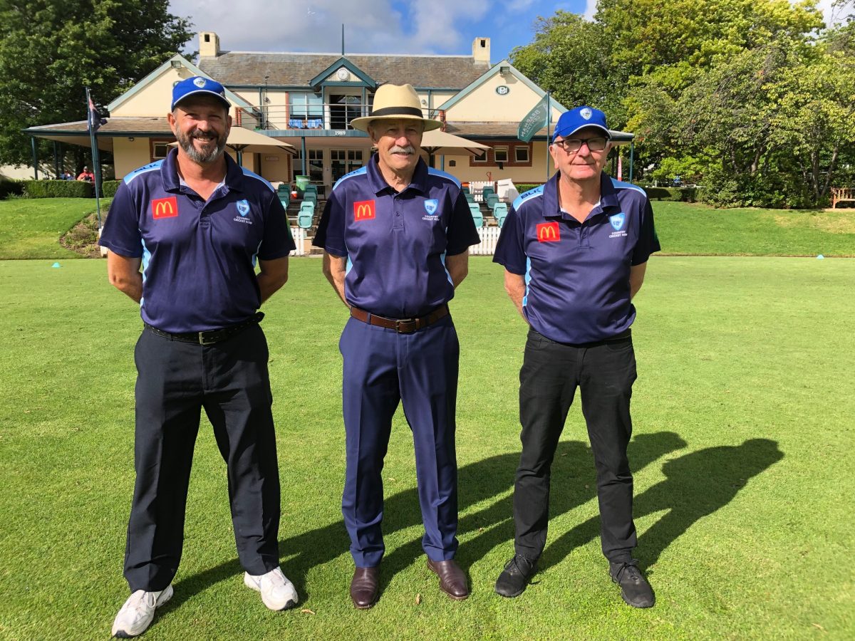 Three cricket umpires before a match.