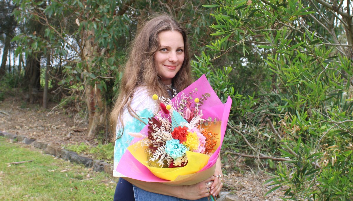 Adriana Mazevski from Tuesday Euphoric with a bunch of flowers. 