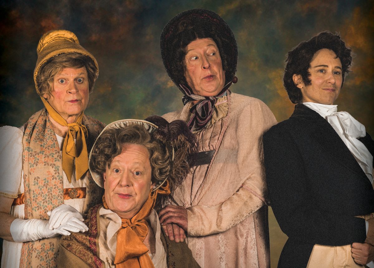 Four men in costume for Pride and Prejudice comedy revue