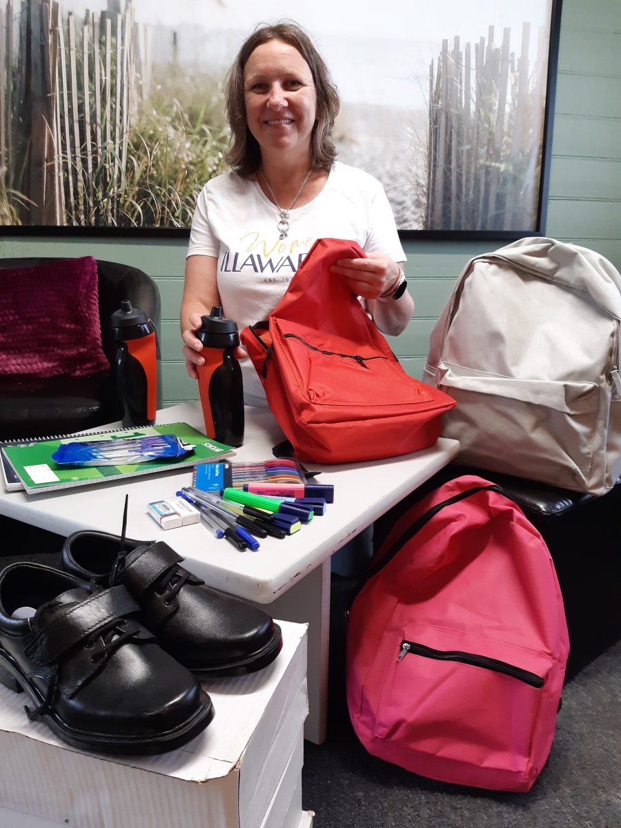 Volunteers at Women Illawarra are busily putting together backpacks to help ease the financial strain on vulnerable families. 