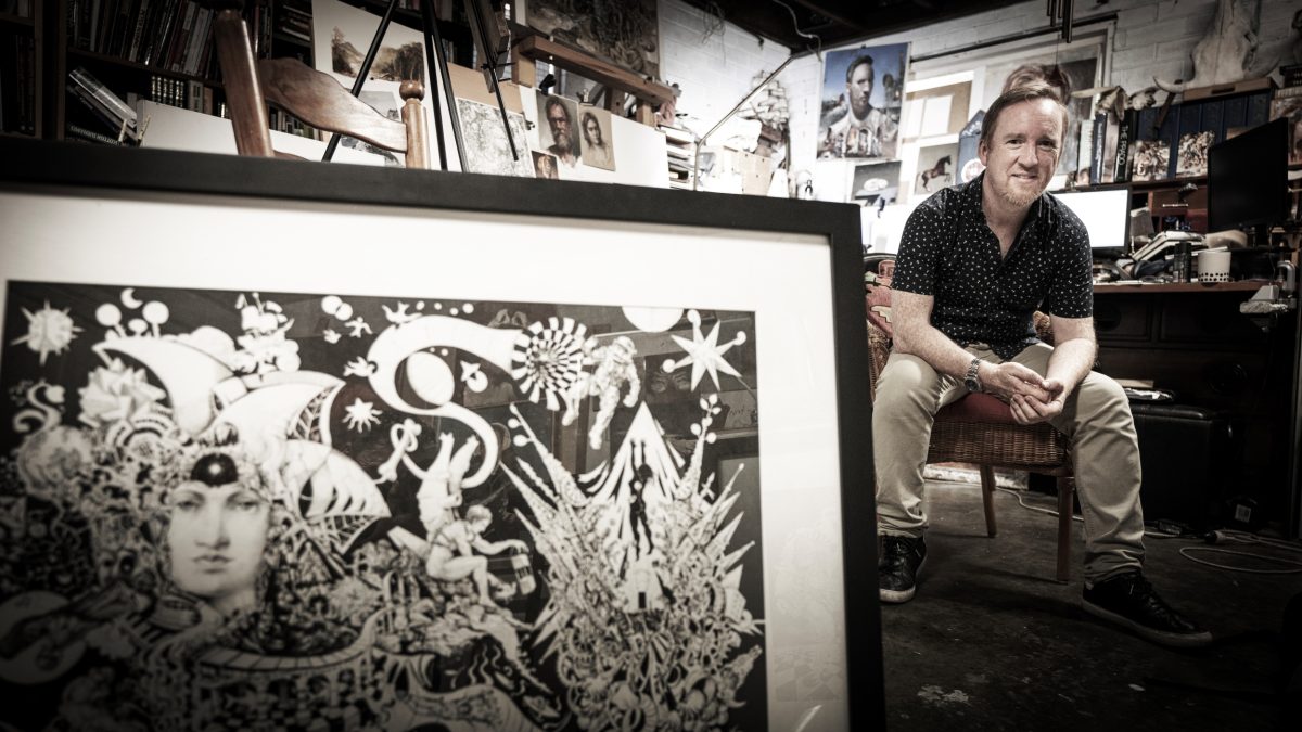 John Kennedy sitting in his art studio