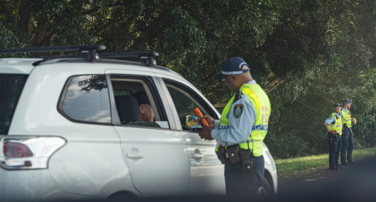 Police doing roadside breath testing.