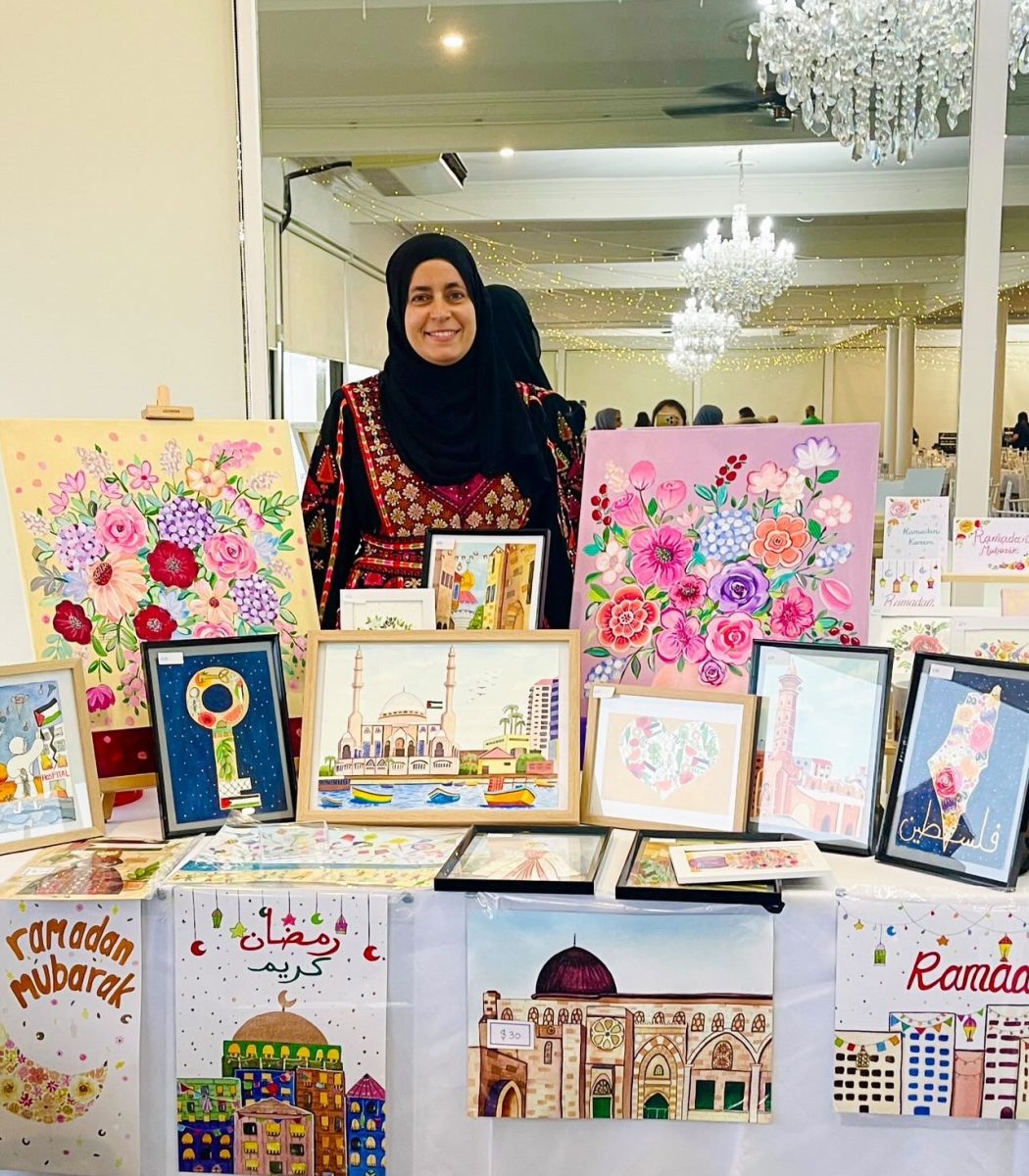 Shellharbour artist Dina Ali with some of her recent artworks. 