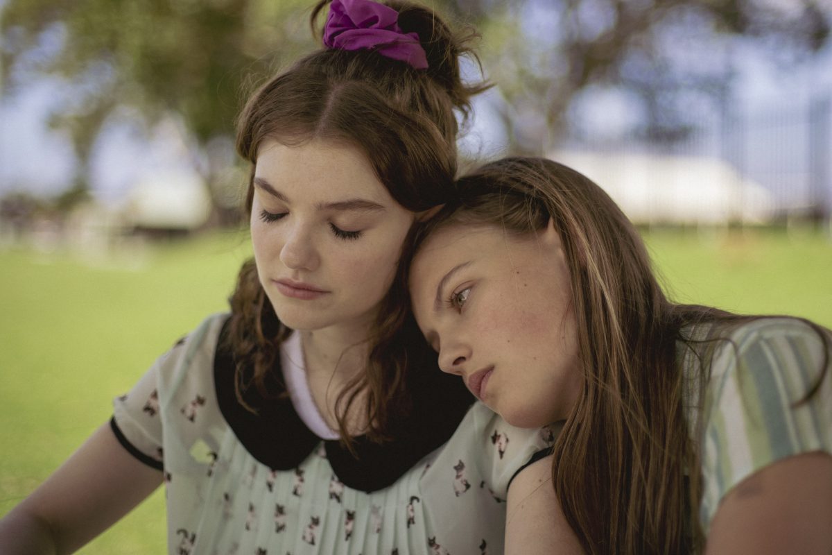 Finding Addison film still showing two girls leaning on each other