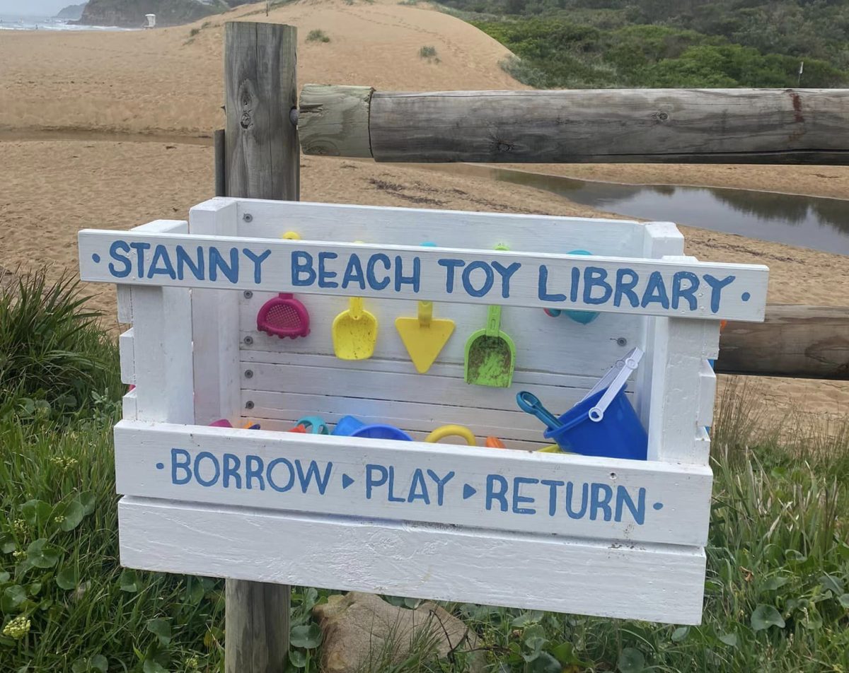 White painted toy box at a beach