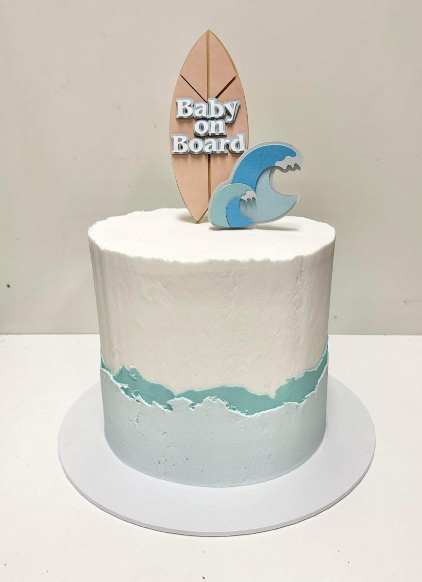 Baby on board cake with surfboard and sea icing from Berkeley Cakes and Pies