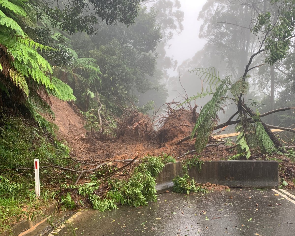 A landslide covering a road.