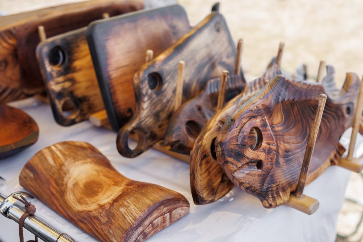 Market stall of handmade wooden utensils. craft market.