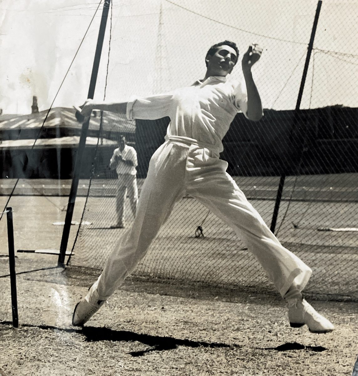 Cricketer bowling in nets