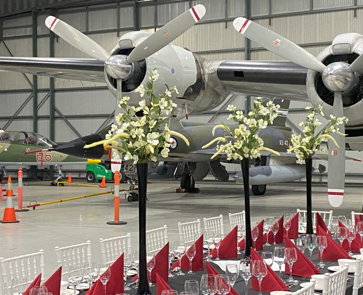 A table setting in front of planes.