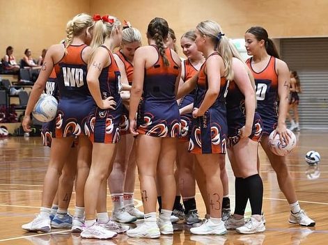 Netball team on court.