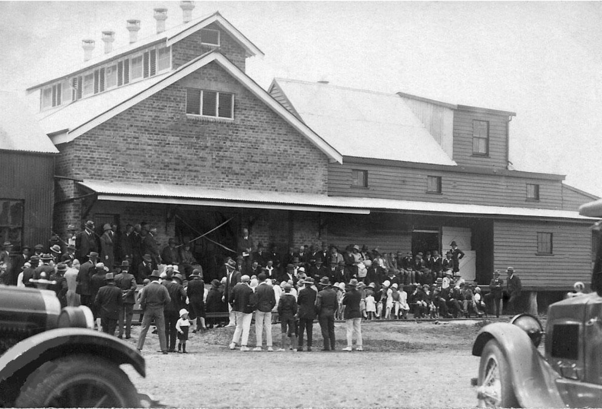 old photo of a crowd at a dairy co-op